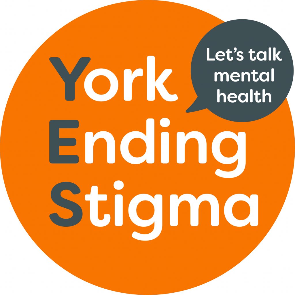 York Ending Stigma Logo: An orange ciircle reads York Ending Stigma with a speech bubble saying "Let's talk mental health"